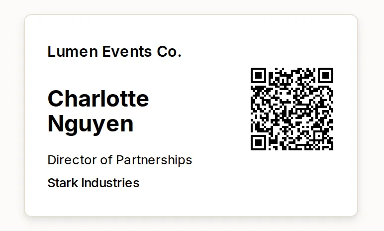 The badge an attendee opens: a landscape card with the workspace name across the top, the attendee's name in large type below it, then their job title and company, and a QR code filling the right-hand side.